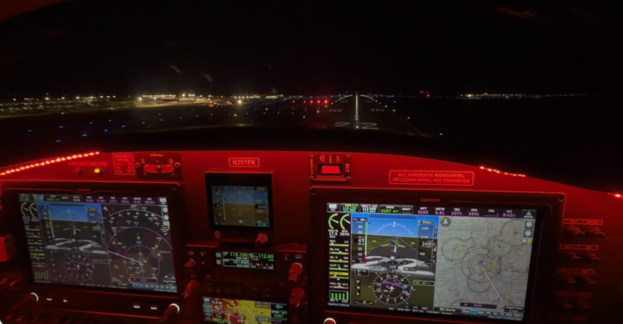 Bristell cockpit view lined up on a runway at night